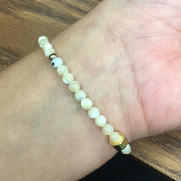 White cross bracelet with gold detail - Picture 6 of 6